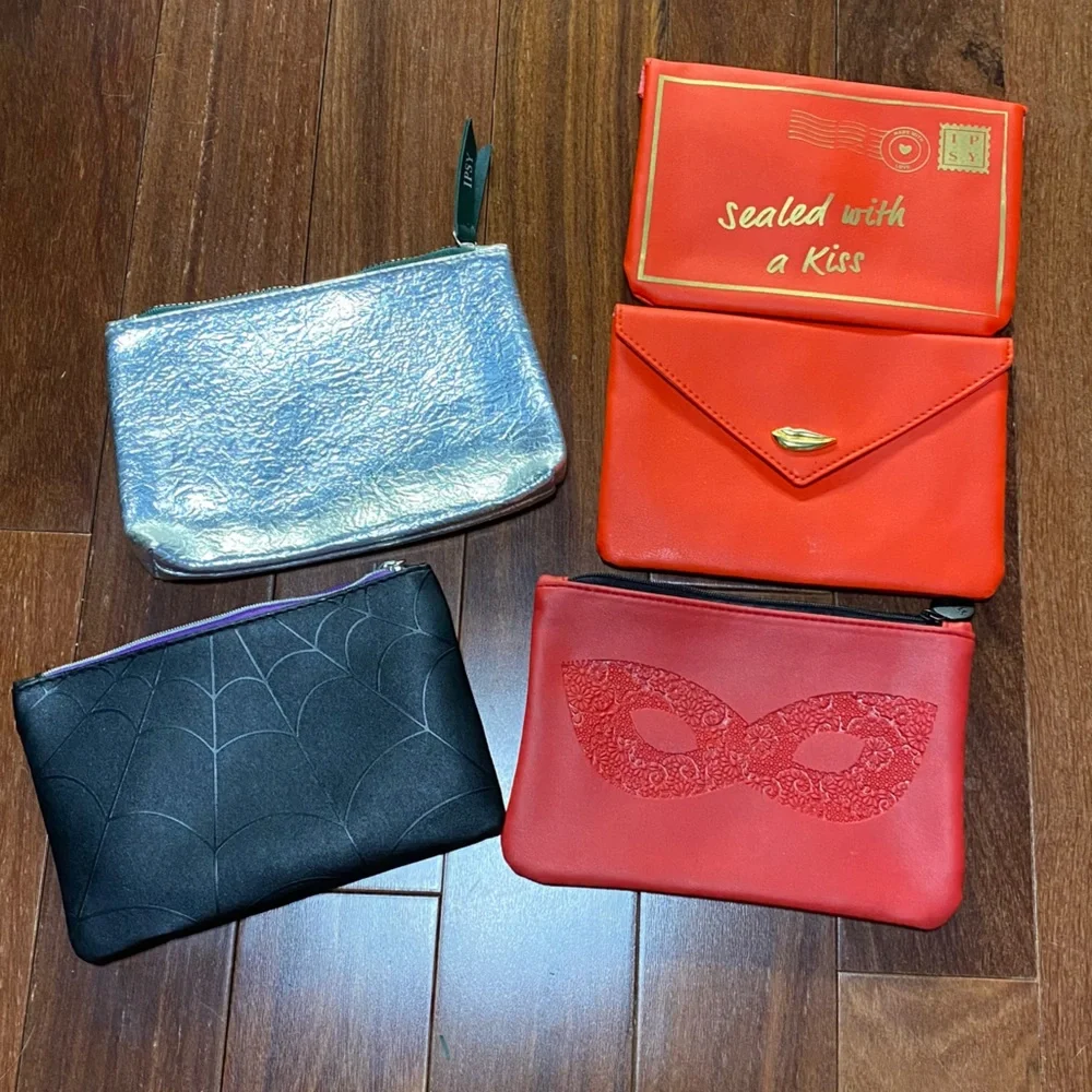 5 ipsy bags including spider web